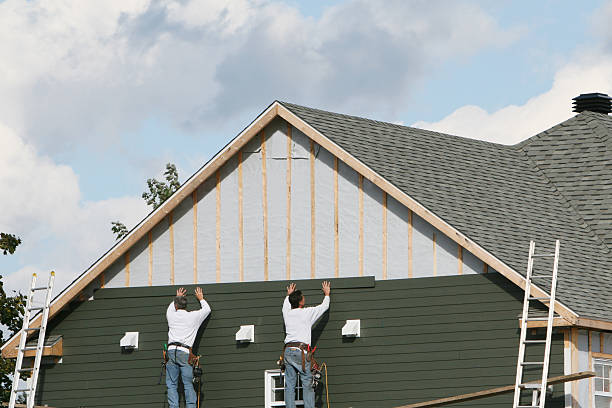Professional Siding technician working in Osteen, FL